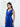 Side view of the Center Dress in navy, showing the silk falling long from the seamed waist.