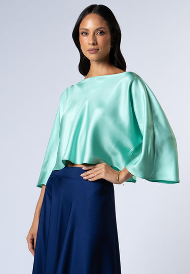 Model wearing the Nicilian Yacht Blouse in Opal, crafted from regenerative silk twill.