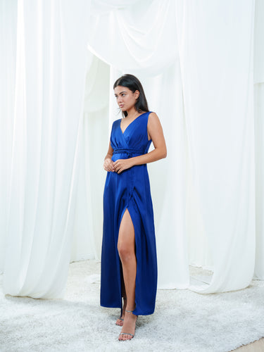 Side view of the Center Dress in navy, showing the silk falling long from the seamed waist.