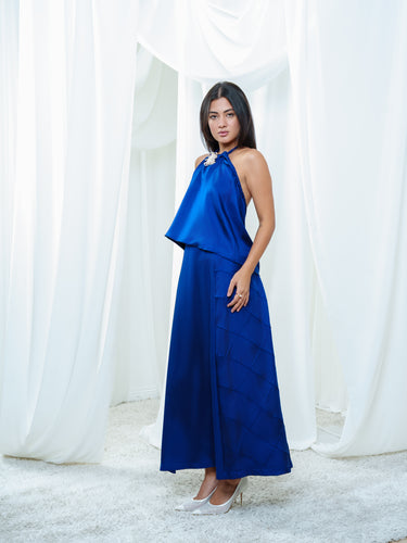 Side view of the Dusk Halter and Dusk Skirt in navy.