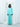 The Exhale set in turquoise, an elevated pyjama-style silk co-ord worn out.