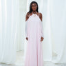 The Vesper Dress in light pink, a silk georgette maxi dress with braided straps and open shoulders.