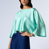Model wearing the Nicilian Yacht Blouse in Opal, crafted from regenerative silk twill. 