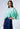 Model wearing the Nicilian Yacht Blouse in Opal, crafted from regenerative silk twill. 