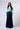 A model wearing the Nicilian Yacht Blouse in Opal and Site Skirt in Beacon Blue, both crafted from regenerative silk twill. This full-length luxury set blends modest elegance with flowing, structured design.